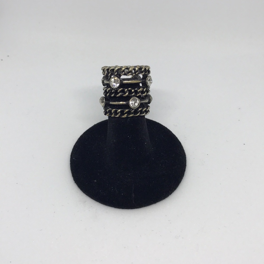 black and silver ring with embellishments